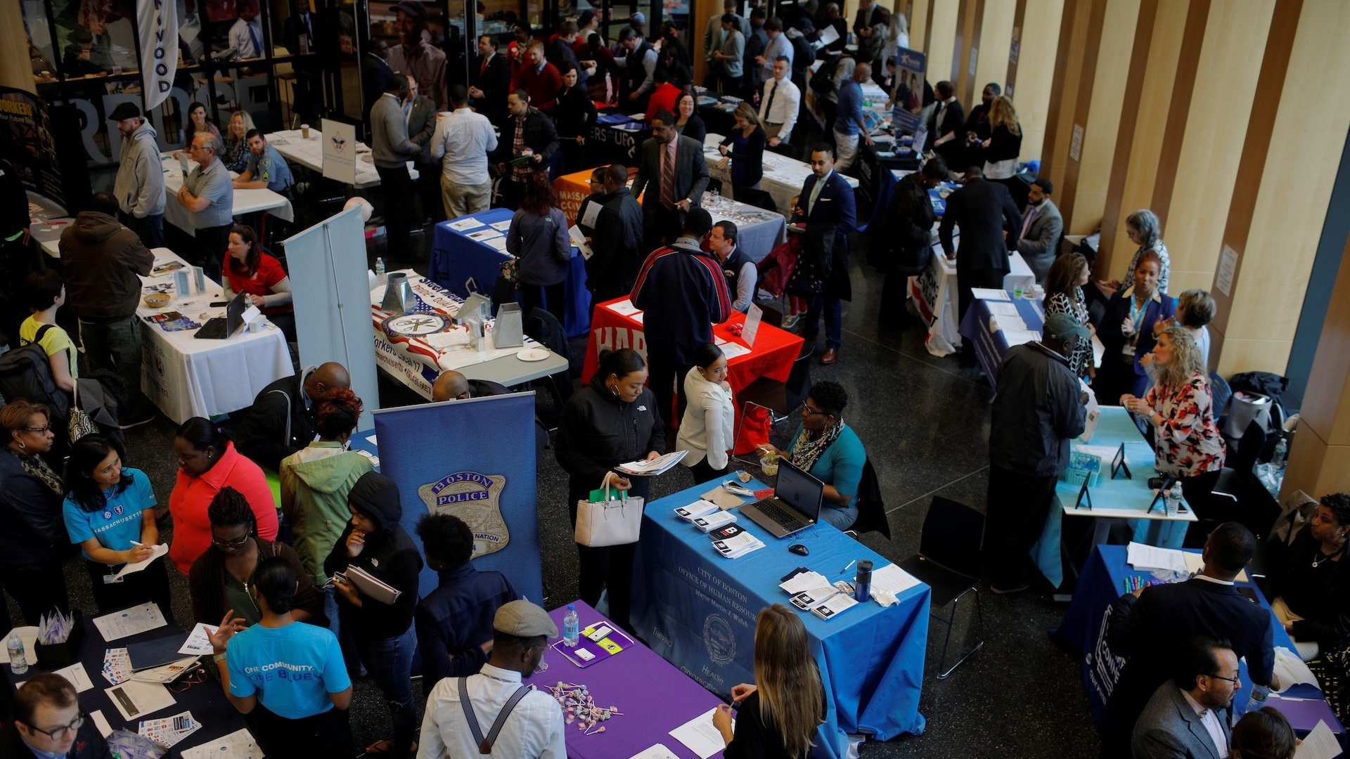 Job seekers speak with potential employers at a City of Boston Neighborhood Career Fair on May Day in Boston, Massachusetts, U.S., May 1, 2017.
